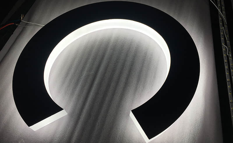 Halo lit stainless steel signs