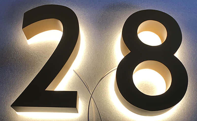 Backlit stainless steel signs