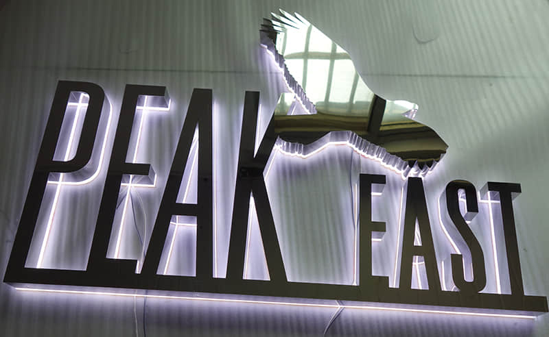 Polished surface backlit signs
