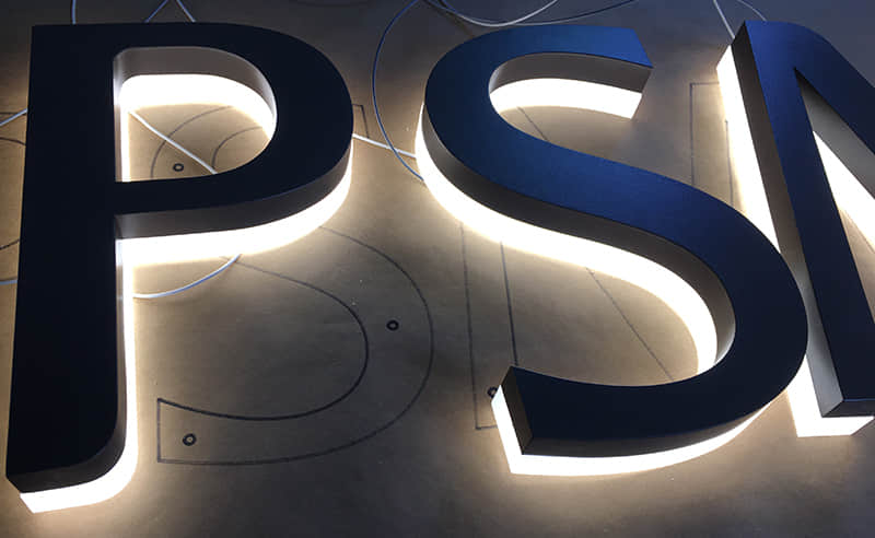 Backlit stainless steel signs
