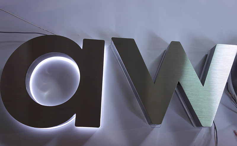 Brushed backlit signs