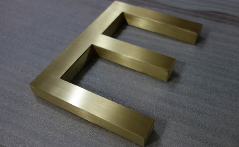 Brushed brass letters