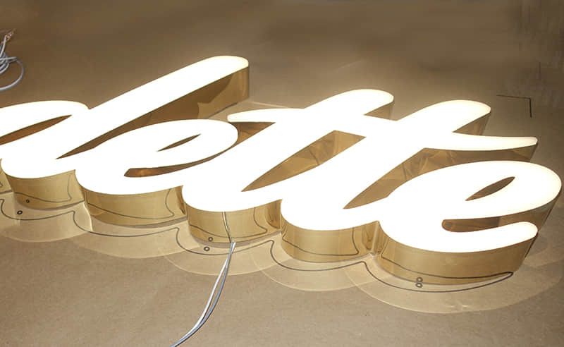 Frontlit trimless brass letters
