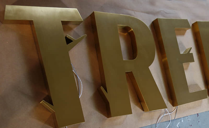 Fabricated brass letters