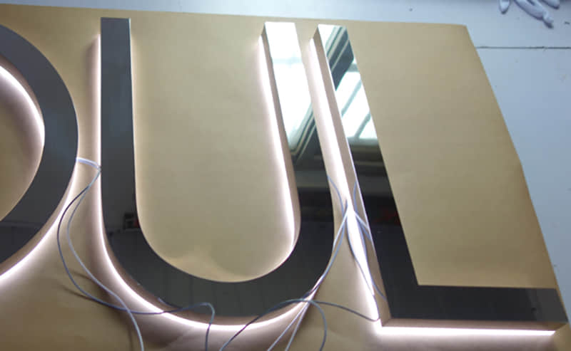 Rear lit stainless steel letters