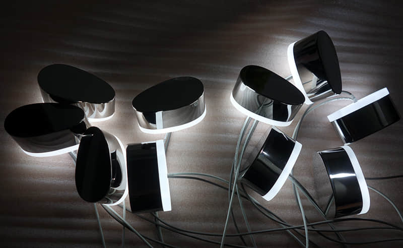 Halo lit stainless steel signs