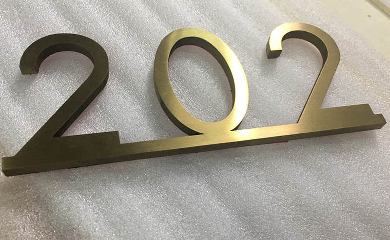 Electroplated solid stainless steel letters