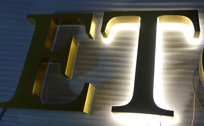 Electroplated backlit signs