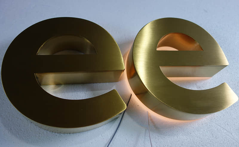 Halo lit stainless steel signs