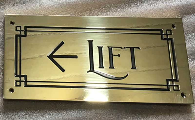 Etched brass signs